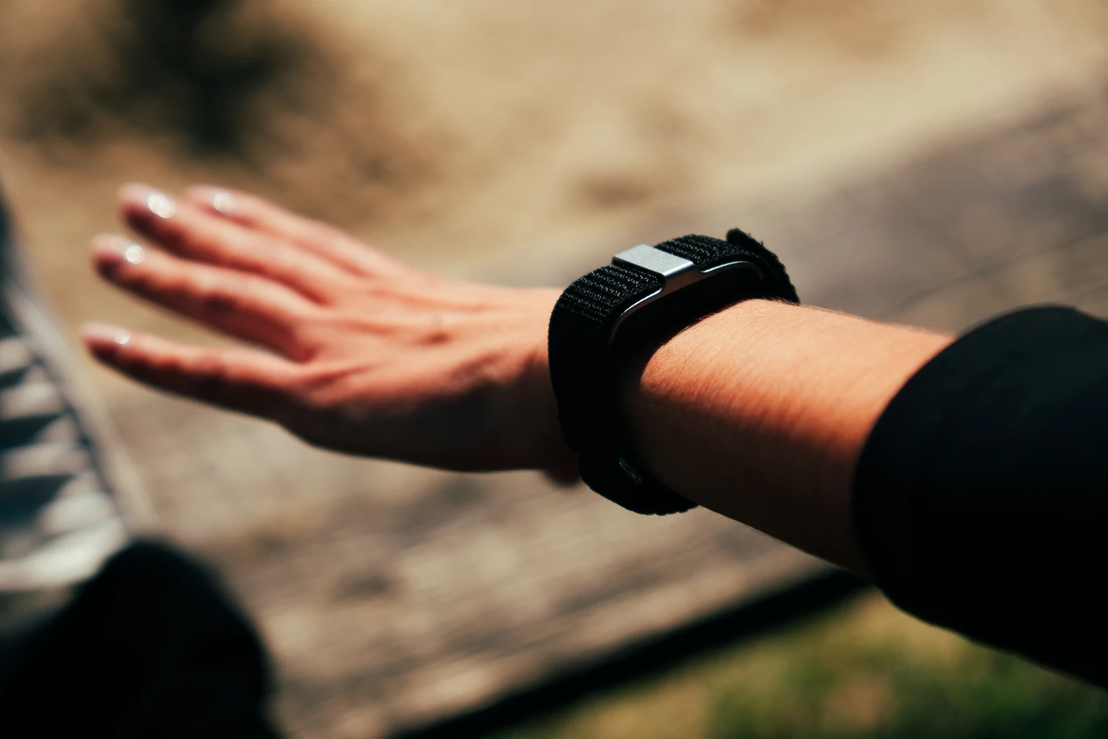 Detail of the black band on a wrist during an outdoor activity